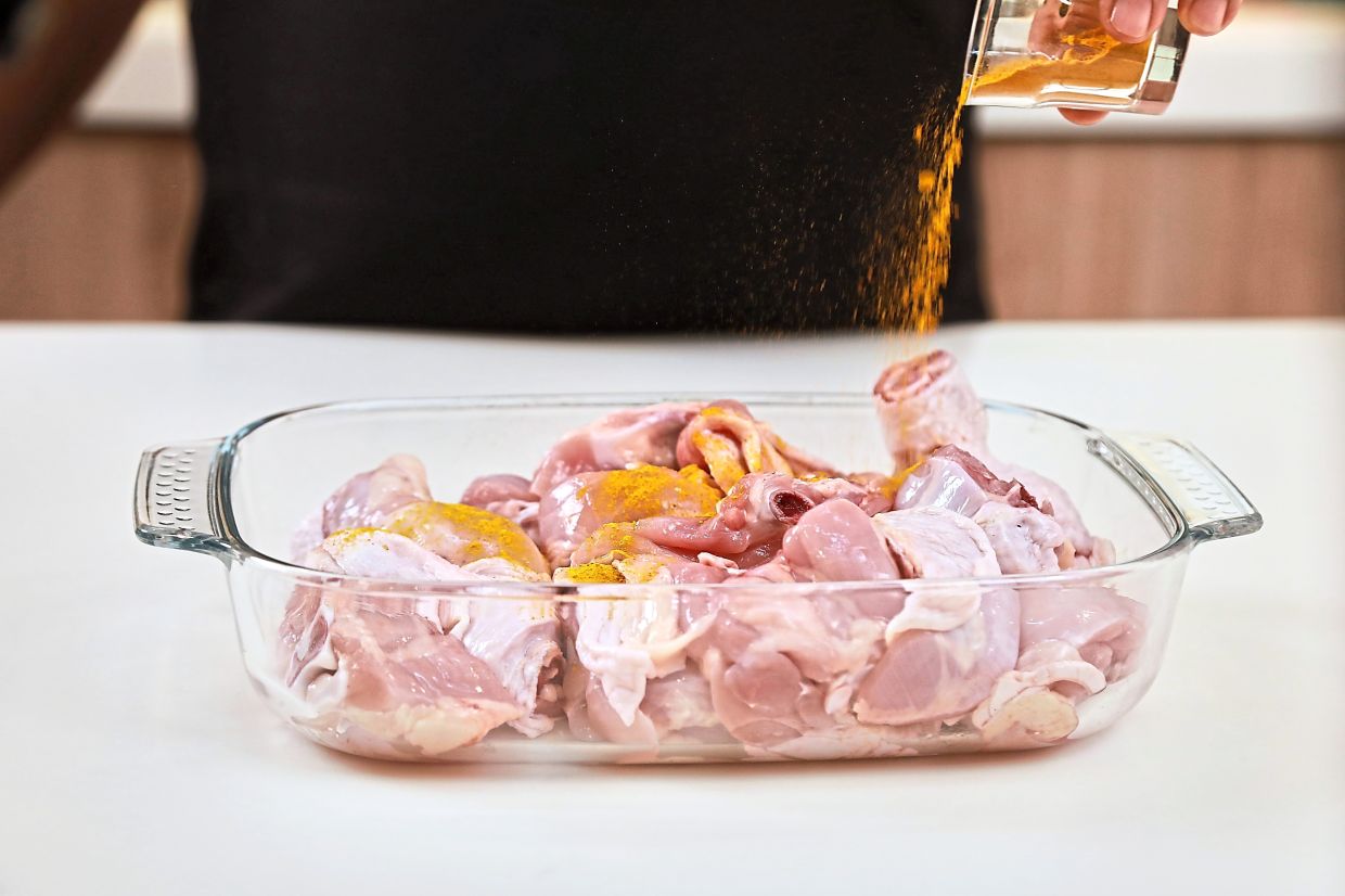 Marinate the chicken in salt and turmeric powder for at least an hour.