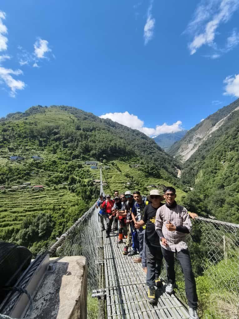 Firdaus (in front), a guide at Gunung Ledang in Johor, and the team on the Jhinnu Dada suspension bridge.