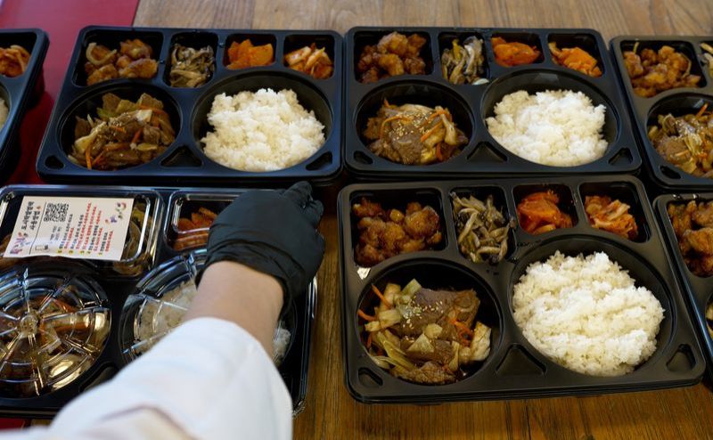 Olympics-Korean athletes get 'rice power' driven to their door away from home
