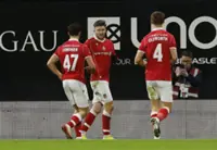Soccer-Wrexham edge Ipswich, Chelsea thump Hull in FA Cup fourth round