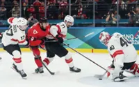 Olympics-Ice hockey-Canada ease past Swiss, Finland beat Sweden, Slovakia, Czechs notch wins