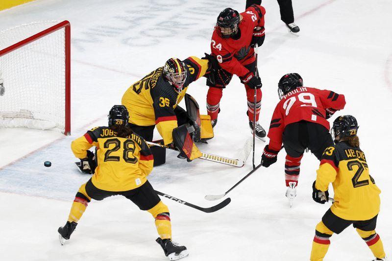 Olympics-Ice hockey-Canada into semis, with Poulin back from injury and equalling scoring record