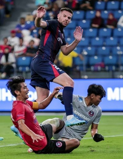 Omen of goals: Johor Darul Ta’zim’s Ajdin Mujagic comes close to scoring against Melaka ahead of his hattrick in the 5-0 win on Friday.— Bernama