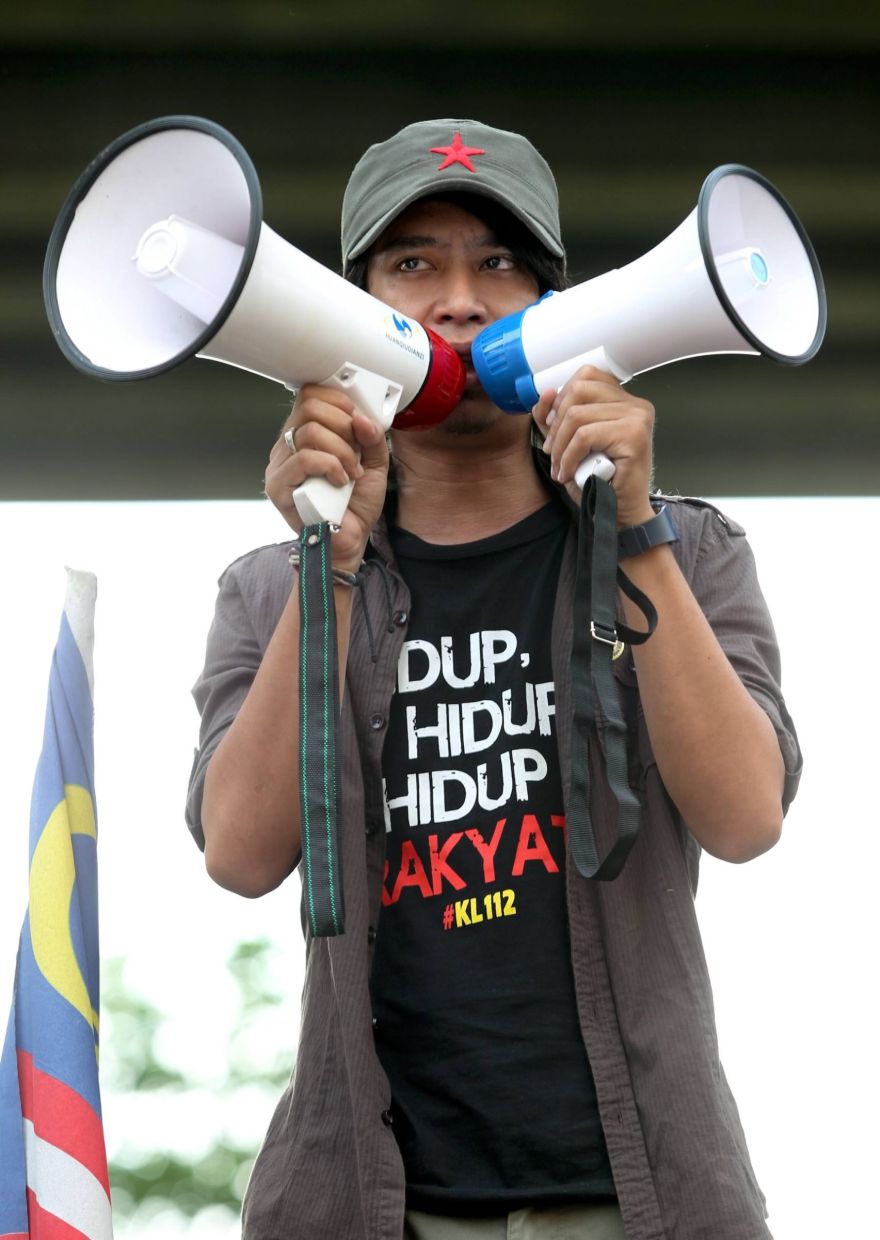 Then student activist Adam delivering his speech before the rally started at Ar-Rahman Mosque. —IZZRAFIQ ALIAS / The Star.