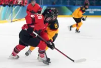 Olympics-Ice hockey-Poulin back with a bang for Canada but happy just to be on the ice