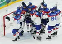 Olympics-Ice hockey-Slovakia win group, US beat Denmark, Finland, Latvia notch wins