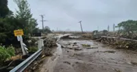 New Zealand braces for more flooding after road collapses, one death