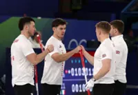 Olympics-Curling-Britain's men beat Germany, champions Sweden lose again