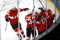 Olympics-Ice hockey-Canada thrash France 10-2, Swiss top Czechs in OT, Denmark down Latvia