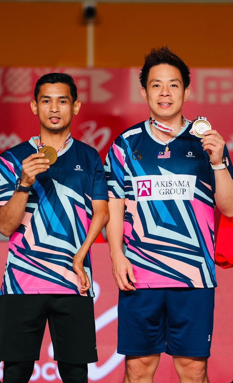 Good job: Faris Ahmad Azri showing off his first world title medal with partner Cheah Liek Hou.