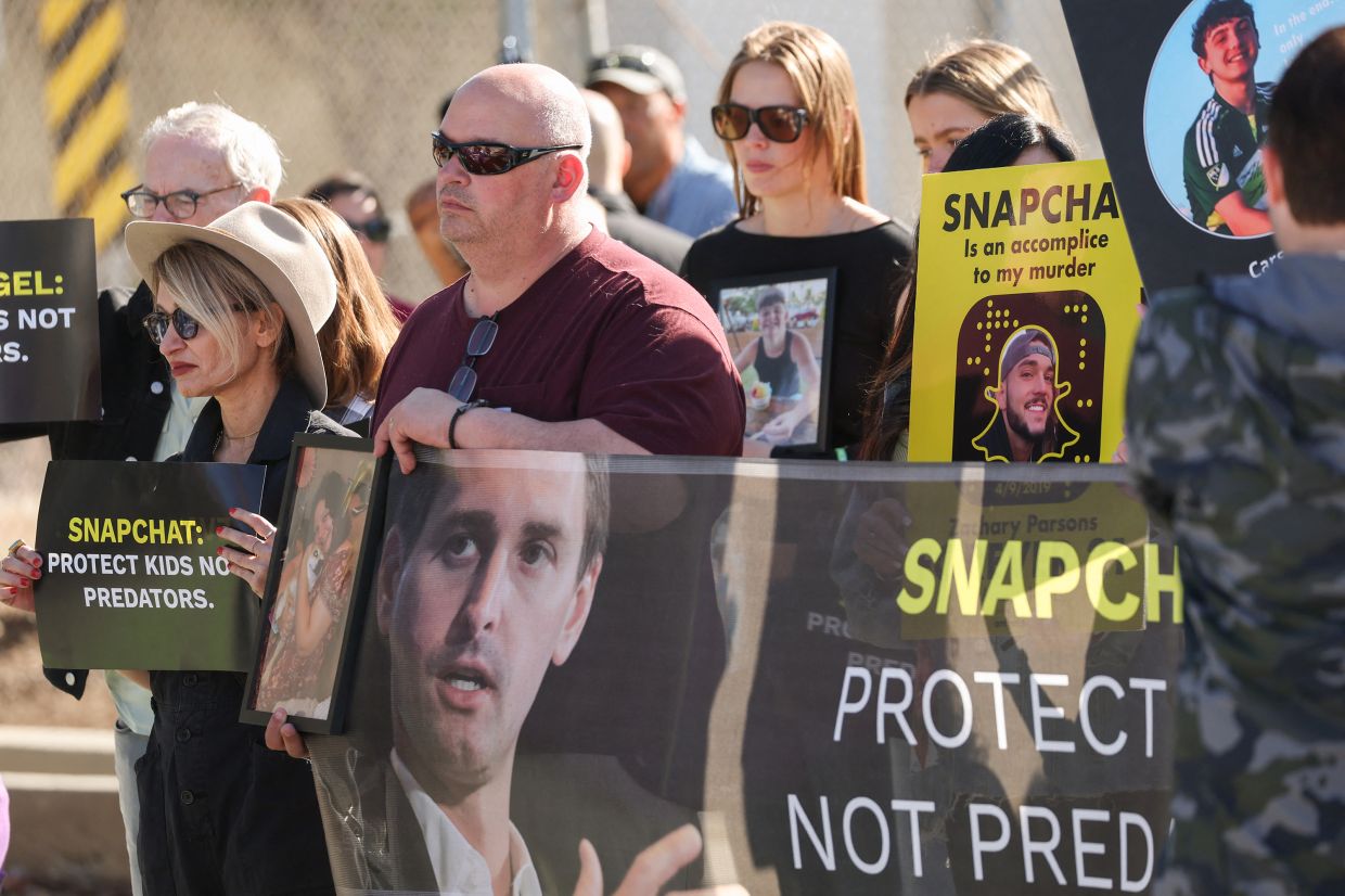 Parents who blame Snapchat for their children's deaths protest outside company's headquarters in the US
