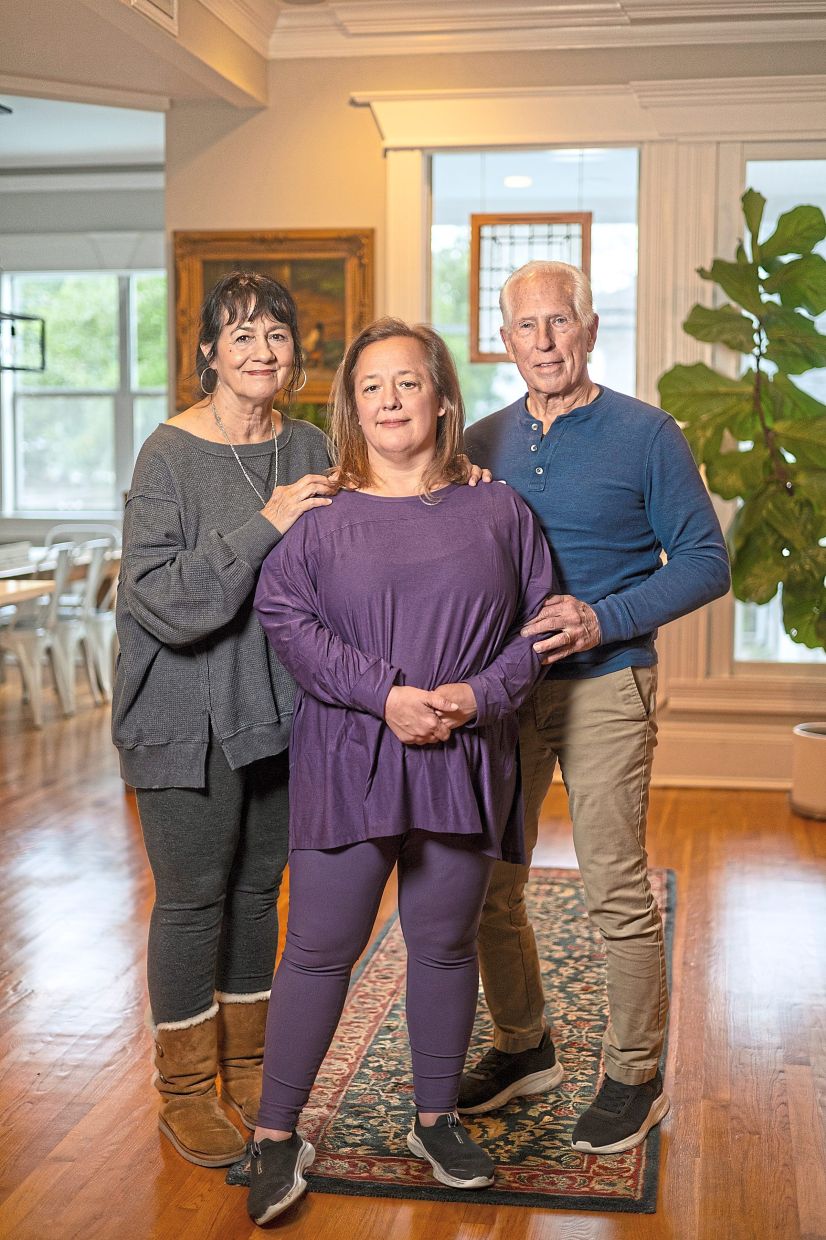 Jill Egle (center), a disability advocate who was a driving force in having the word eliminated at the state level in Virginia, with her parents, Jolyn and Richard. Photo: The New York Times/Kathleen Flynn