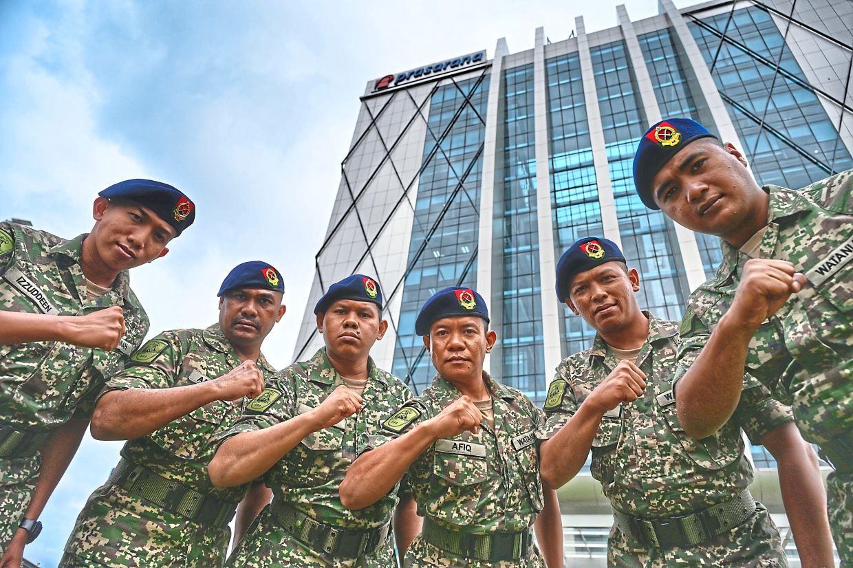 At the ready: Armed Forces personnel at the launch ceremony of the Railway Specialist Regiment’s 50th Rapid Rail Squadron. Despite the defence procurement freeze, Mohamed Khaled said military operations are continuing smoothly. — RAJA FAISAL HISHAN/The Star