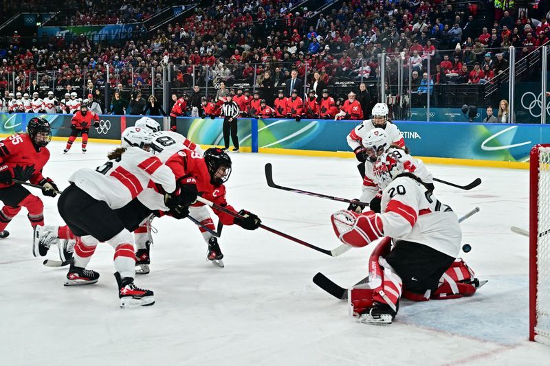 Olympics-Ice hockey-Canada captain Poulin breaks women's Games goal-scoring record