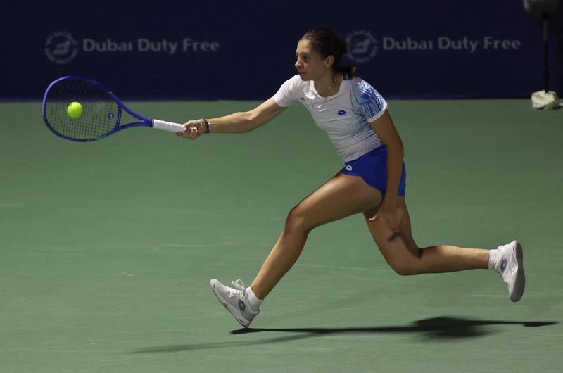 Tennis-Ruzic grabs Dubai spotlight as lucky loser shocks Raducanu
