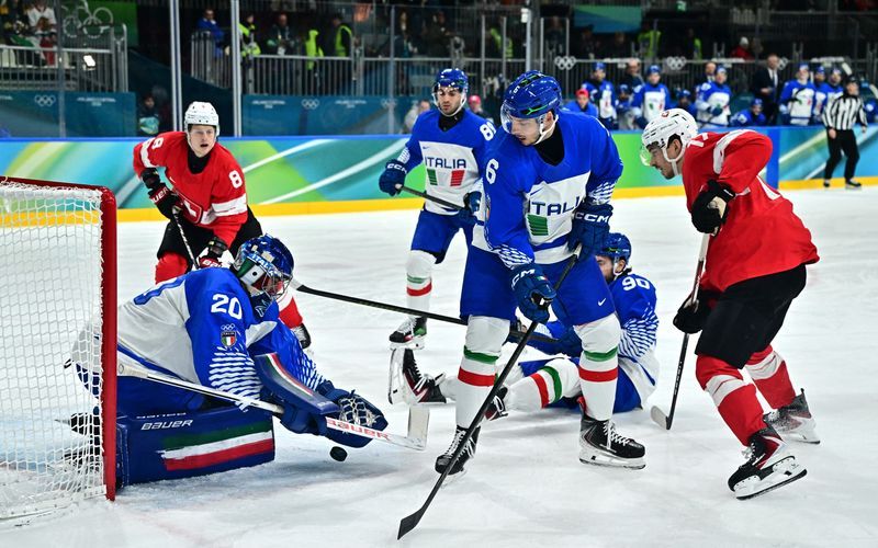 Olympics-Ice hockey-Swiss ease past Italy to set up quarter-final with Finland