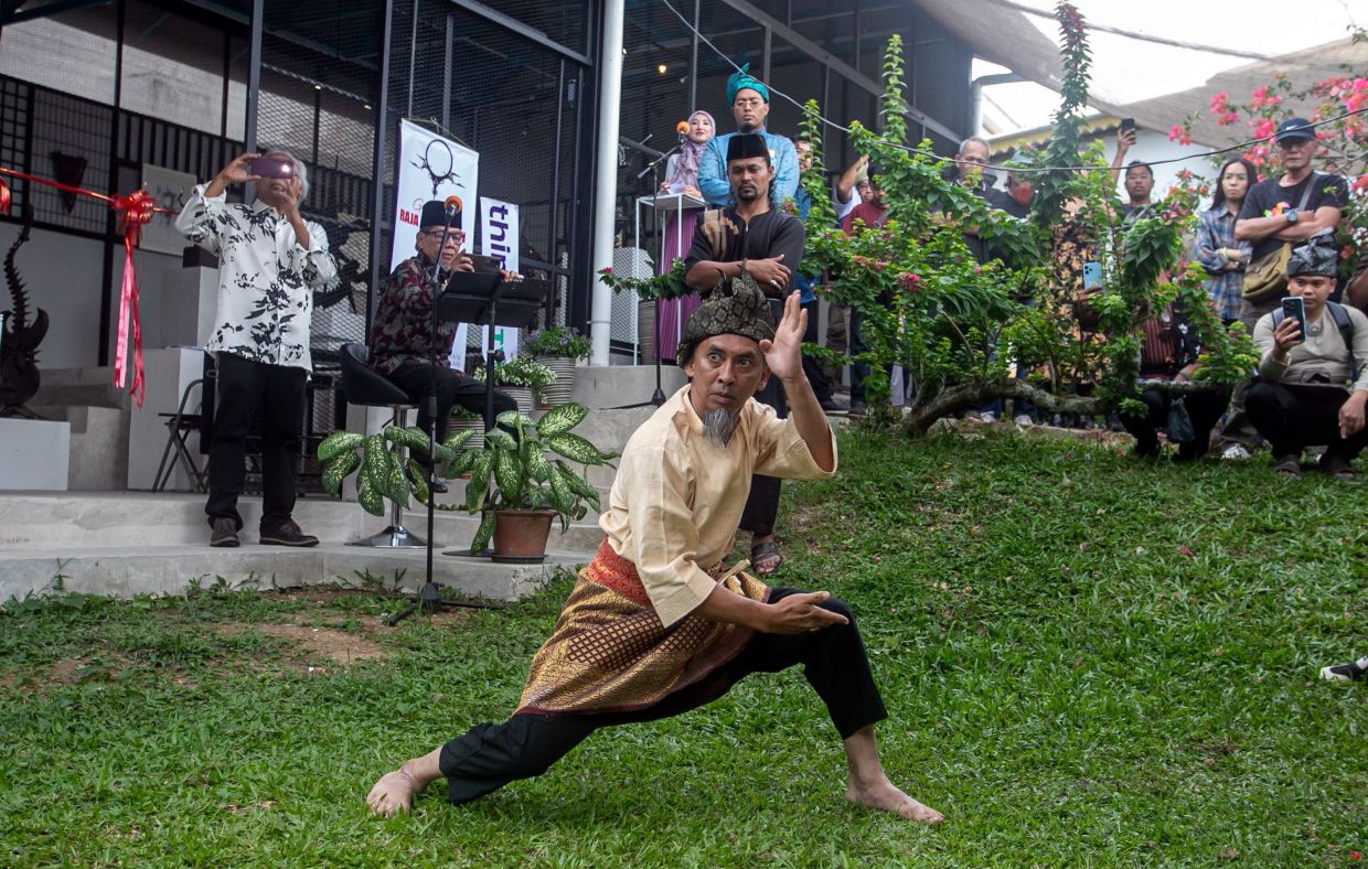 Iron sculptor Raja Shahriman performs a silat demonstration for visitors during the recent opening of the Raja Shahriman Art Gallery in Bukit Chandan. Photo: Bernama