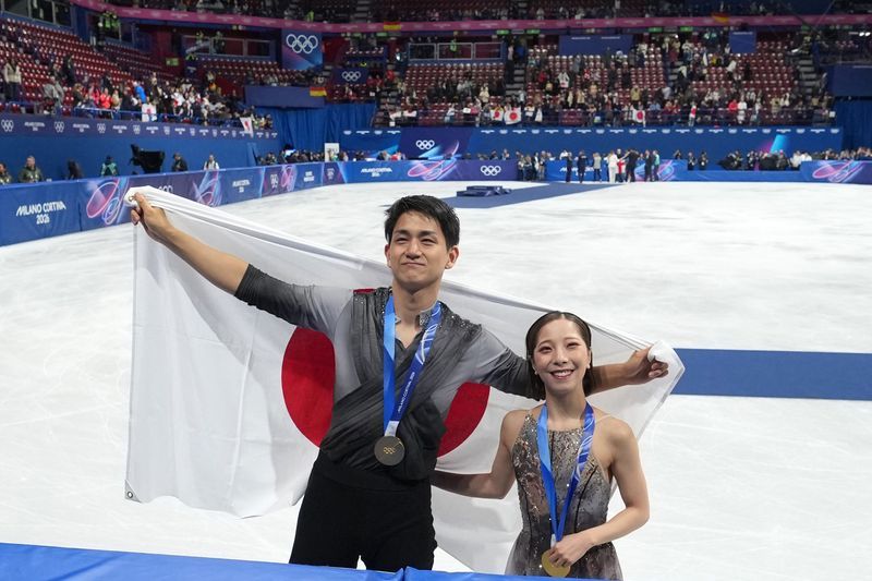 Olympics-Figure skating-Japan's Miura and Kihara say pairs gold 'hasn't hit' after comeback win