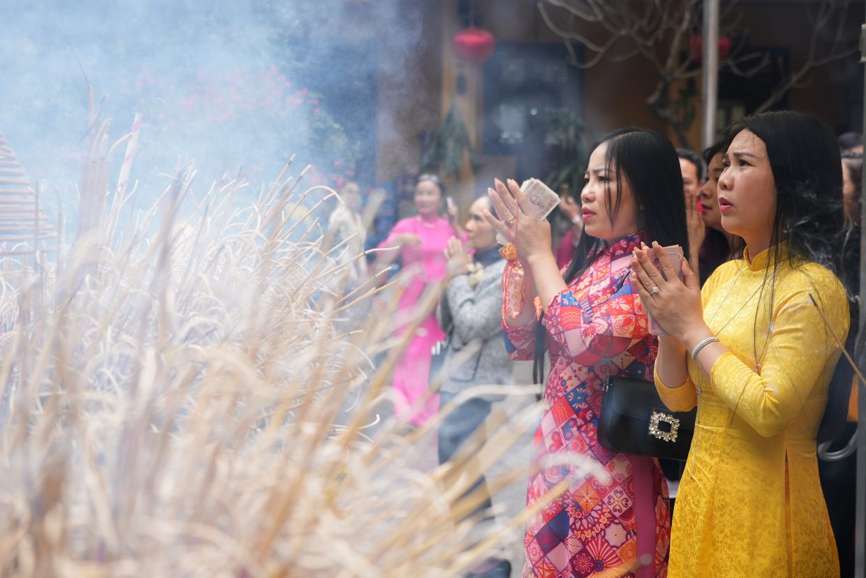 People pray at Quan Su pagoda on the first day of the Lunar New Year in Hanoi, Vietnam, Tuesday, Feb. 17, 2026. -- AP Photo/Hau Dinh