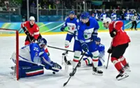 Olympics-Ice hockey-Swiss ease past Italy to set up quarter-final with Finland
