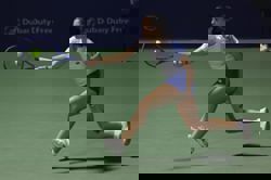 Tennis-Ruzic grabs Dubai spotlight as lucky loser shocks Raducanu