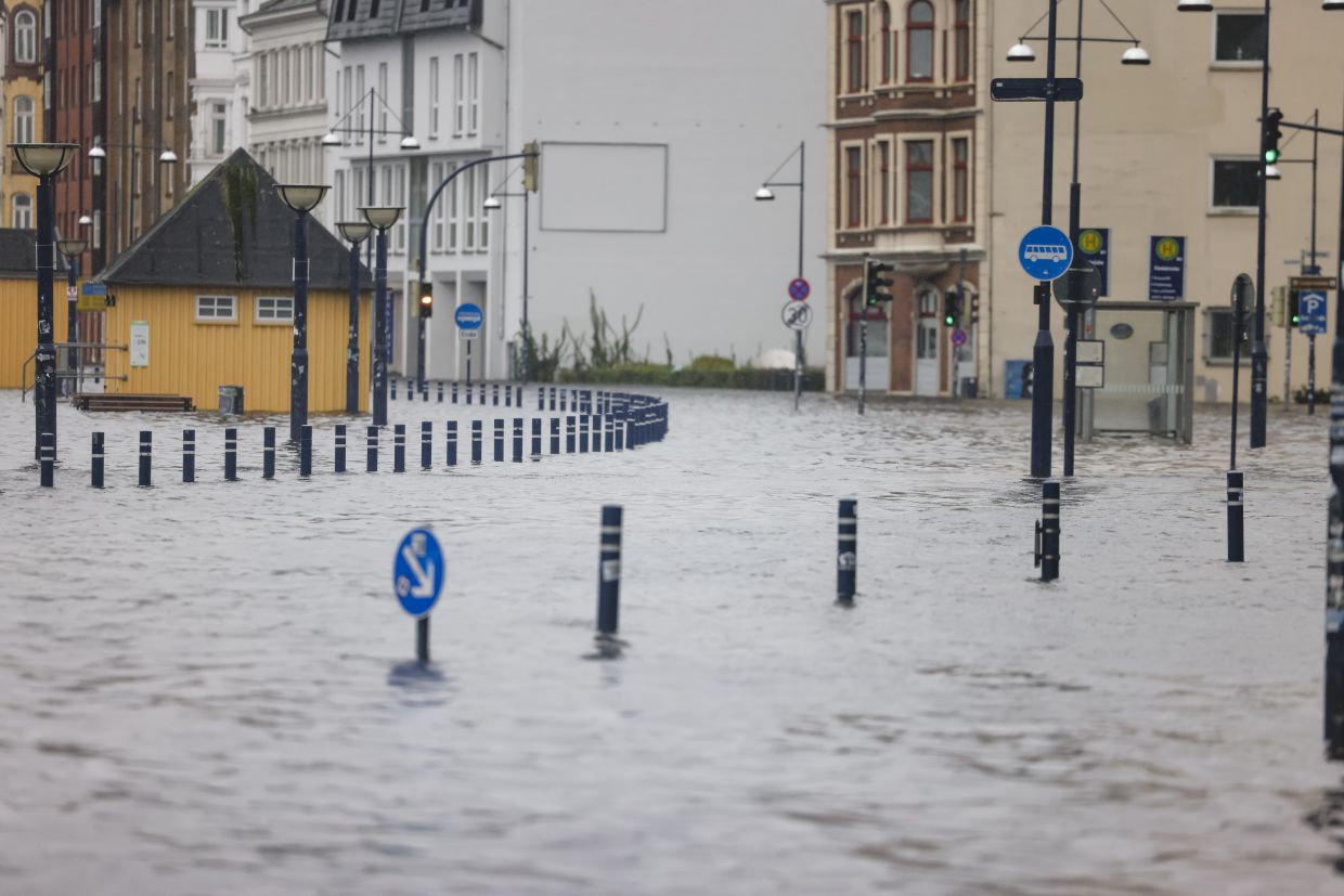 A flooded street in Flensburg. The northern German town is on a bay of the Baltic Sea. — Photo: Frank Molter/dpa