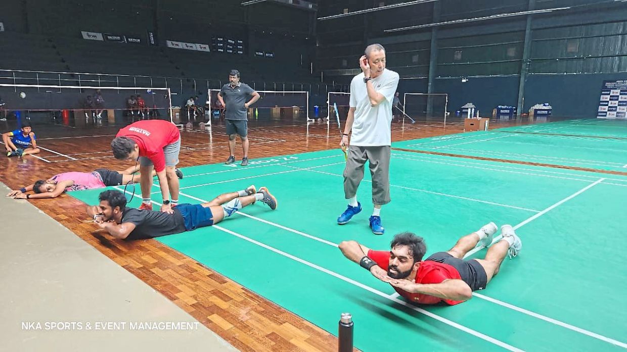 Out-of-the-box approach: Datuk Misbun Sidek watching over the shuttlers during a training session at the Hatsun Badminton Centre.