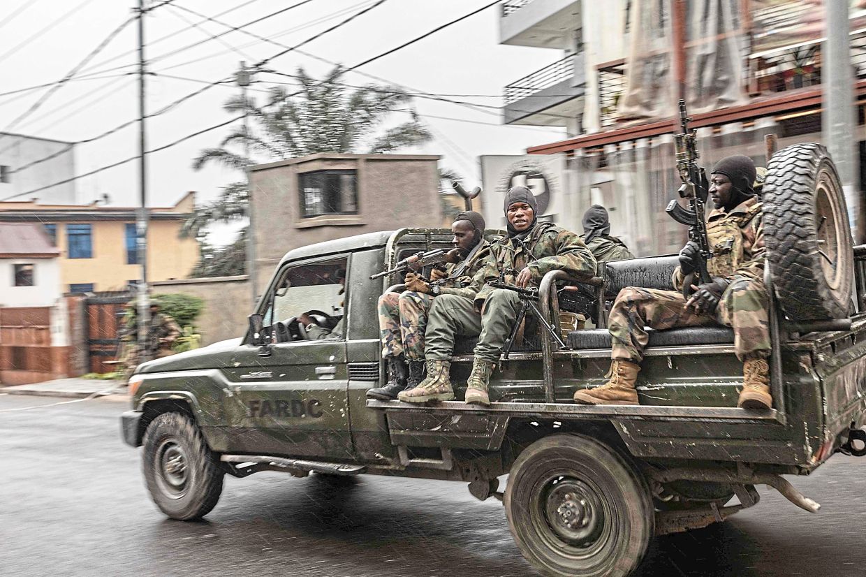 M23 members riding in a vehicle formerly belonging to the Armed Forces of the Democratic Republic of Congo while patrolling a street in Goma on Jan 29, 2025. — AFP 