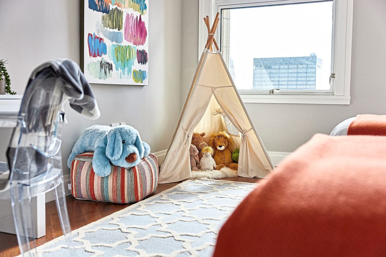 A powder blue area rug helps to anchor this children's bedroom. (Handout/TNS)