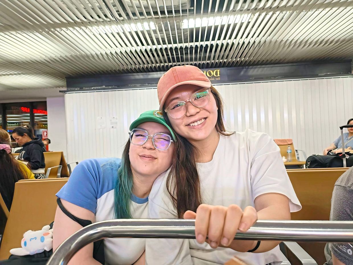 In their family, Shelly (left) and Ashley views following traditions as a way to unitefamilies during the festive season. Photo: Shelly Tan