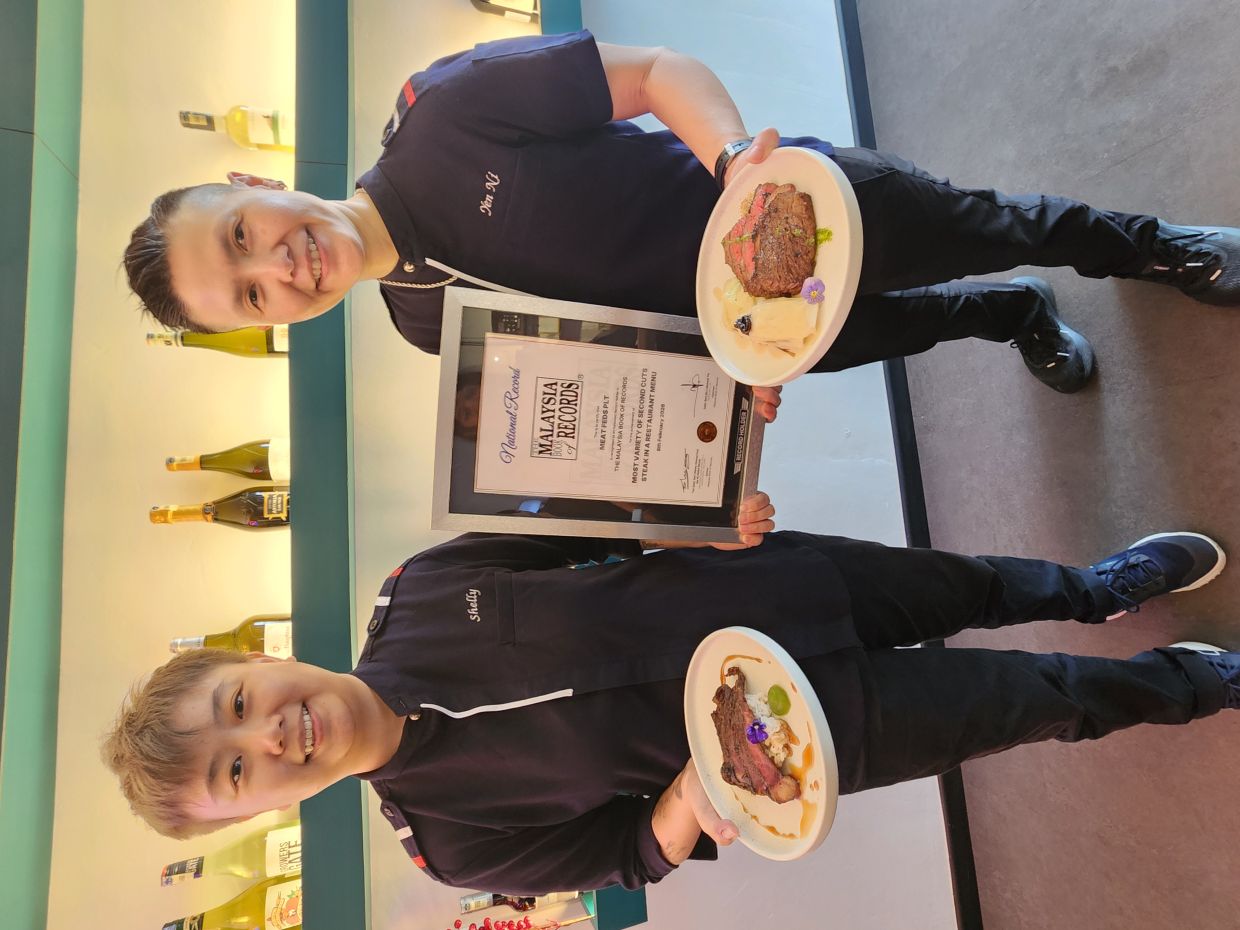 Law (right) and Saw say what they are doing is rare, as few chefs want to work with secondary cuts, given the amount of work it involves. — Photos: ABIRAMI DURAI/The Star