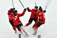 Olympics-Ice hockey-Canada survive OT thriller with Czechs to reach men's semis