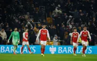 Soccer-Sloppy Arsenal implode in 2-2 draw at bottom side Wolves
