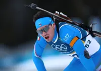Olympics-Biathlon-Italy's Giacomel rues lack of Olympic village as he hopes for more success