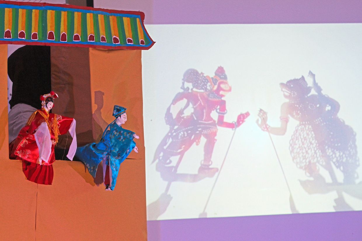 Students representing Hikarya show their skills in a wayang kulit presentation.