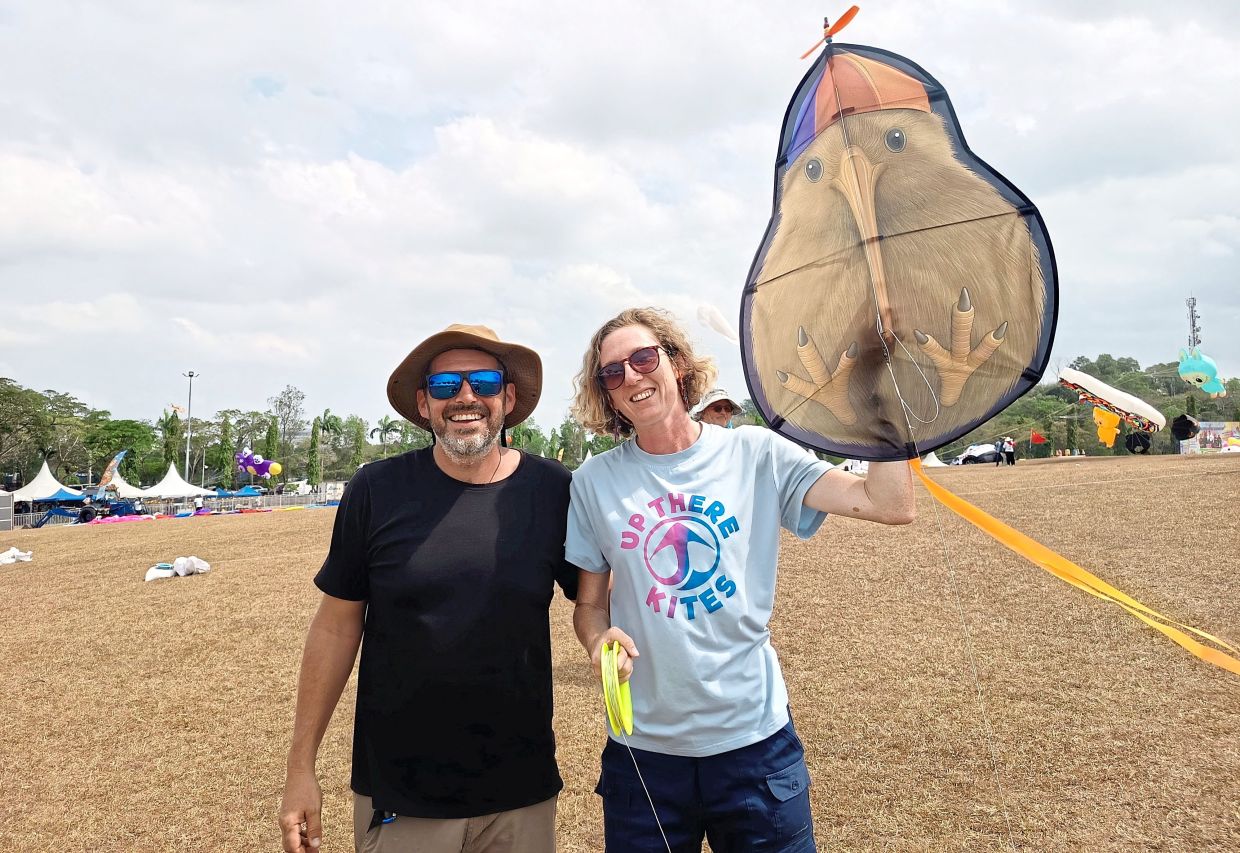 Newbies Kassler (right) and Nagy now ensnared by the magic of a kite festival.