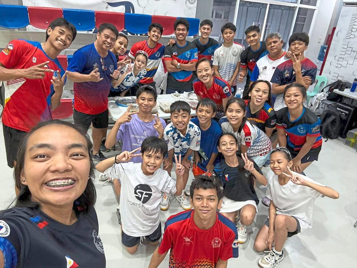Party time: The mini Chinese New Year celebration at the Philippines Squash Academy with Low Wee Wern (second row from the back, third from right).