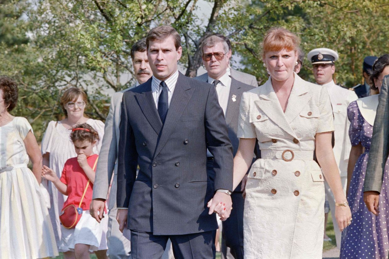 Lady Sarah Ferguson (right) and Prince Andrew (centre) walk hand in hand on July 18, 1989 at the Montreal Botanical Gardens. Photo: AFP