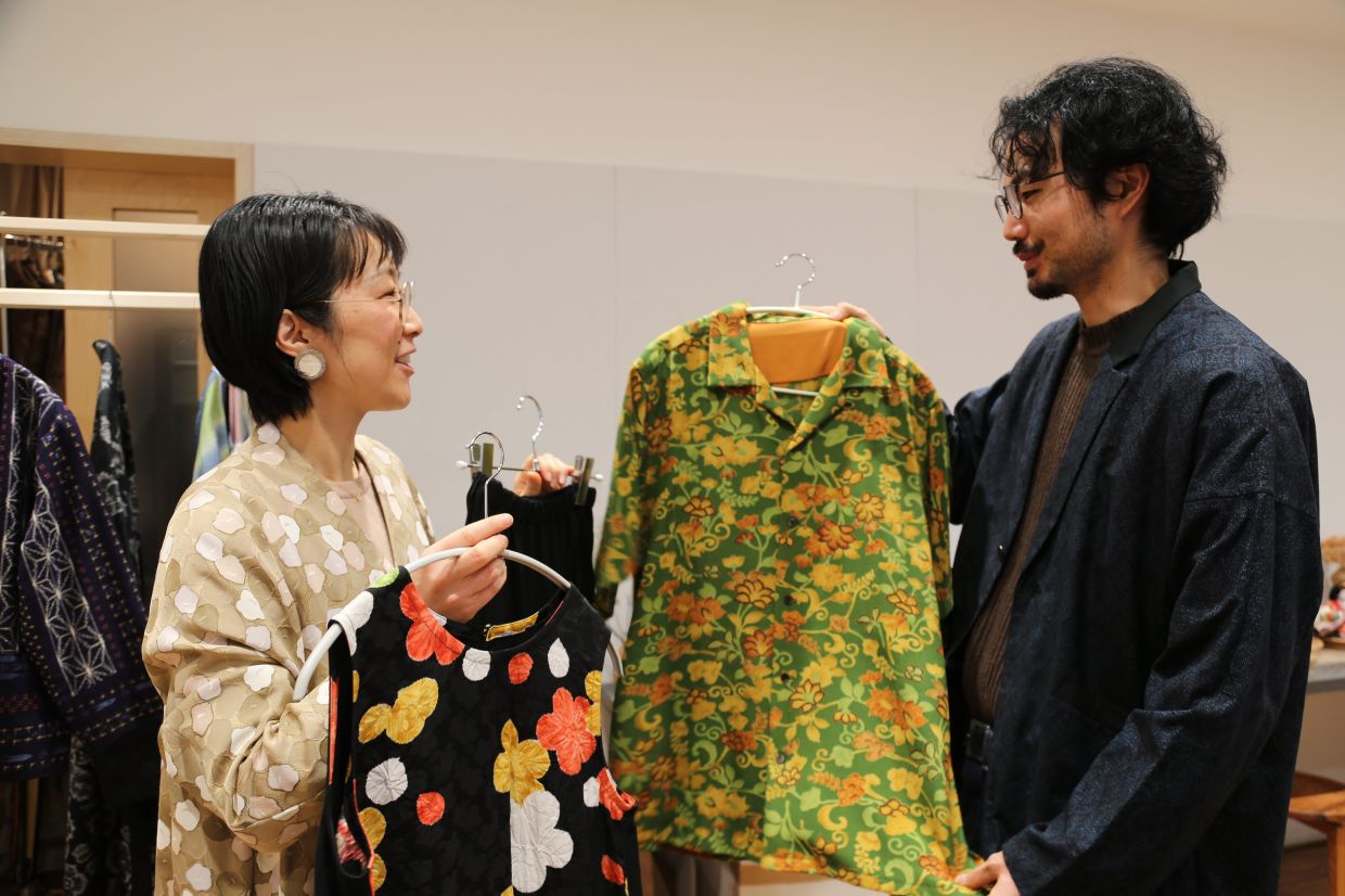Designer Tomoko Ohkata (left) and her assistant Koki Unami hold Ohkata's designs made from old kimono. Photo: AP