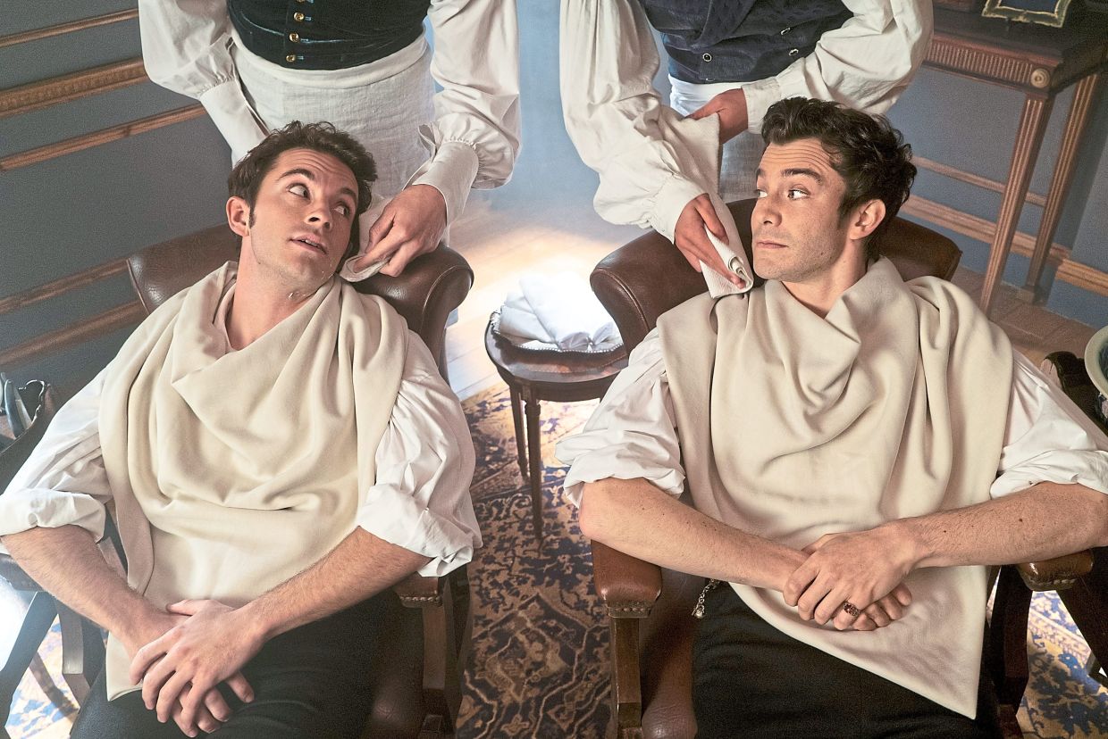 Thompson (right) sharing a scene with Jonathan Bailey – who plays his character's older brother, Anthony Bridgerton – in the second season of the romance series. — Handout