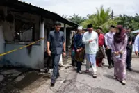 Plight of two families in Banting fire draws Anwar's attention