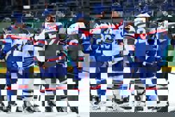 Olympics-Ice hockey-US rout Slovakia to set up final showdown with Canada