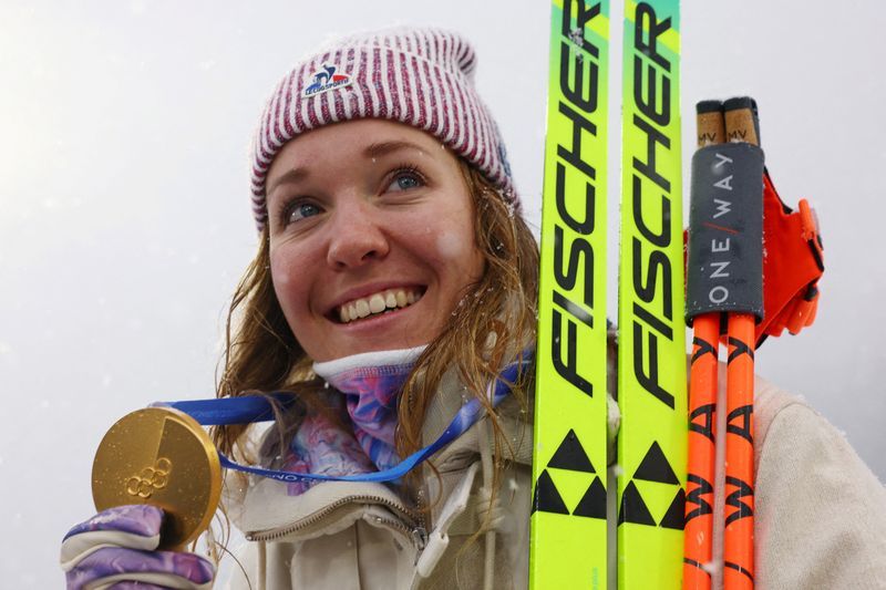 Olympics-Biathlon-Oceane rides wave of energy to stunning Olympic gold for France