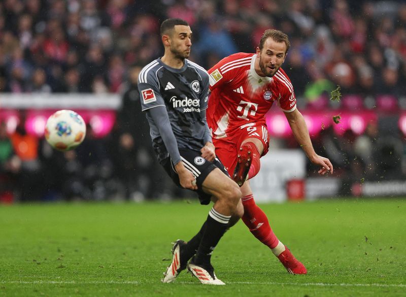Soccer-Kane double sends Bayern nine points clear after late Frankfurt scare