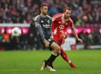 Soccer-Kane double sends Bayern nine points clear after late Frankfurt scare