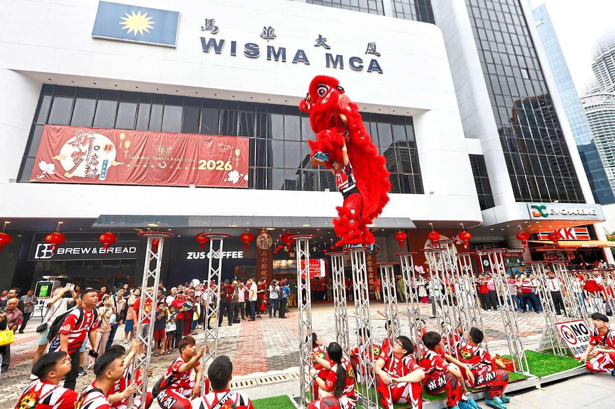 A bright, loud welcome with an energetic lion dance performance at Wisma MCA for the Chinese New Year celebration.