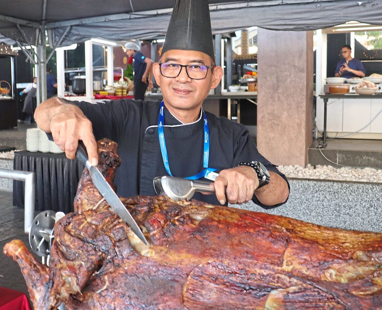 Azramrizal with T-Cafe’s signature grilled lamb. — Courtesy photos