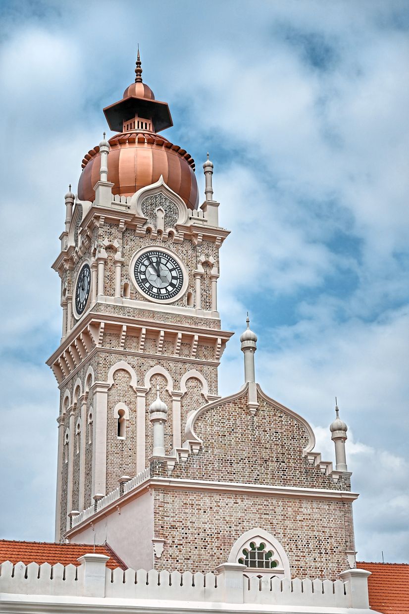 The copper-domed clock tower stands as the most recognisable skyline feature of Bangunan Sultan Abdul Samad. — Photos: RAJA FAISAL HISHAN/The Star