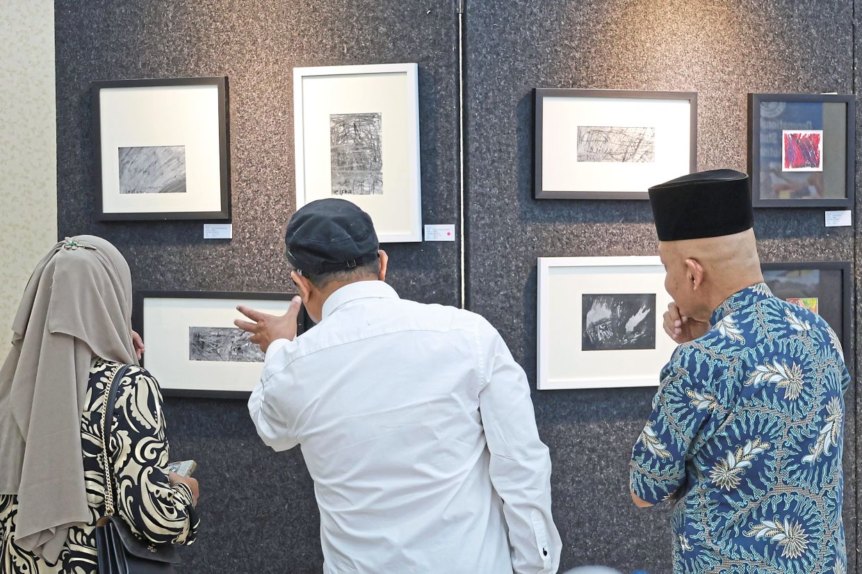 Art pieces from classes conducted by Rosli for Sekolah Sinar Harapan students on display at the Penang Legislative Assembly building.
