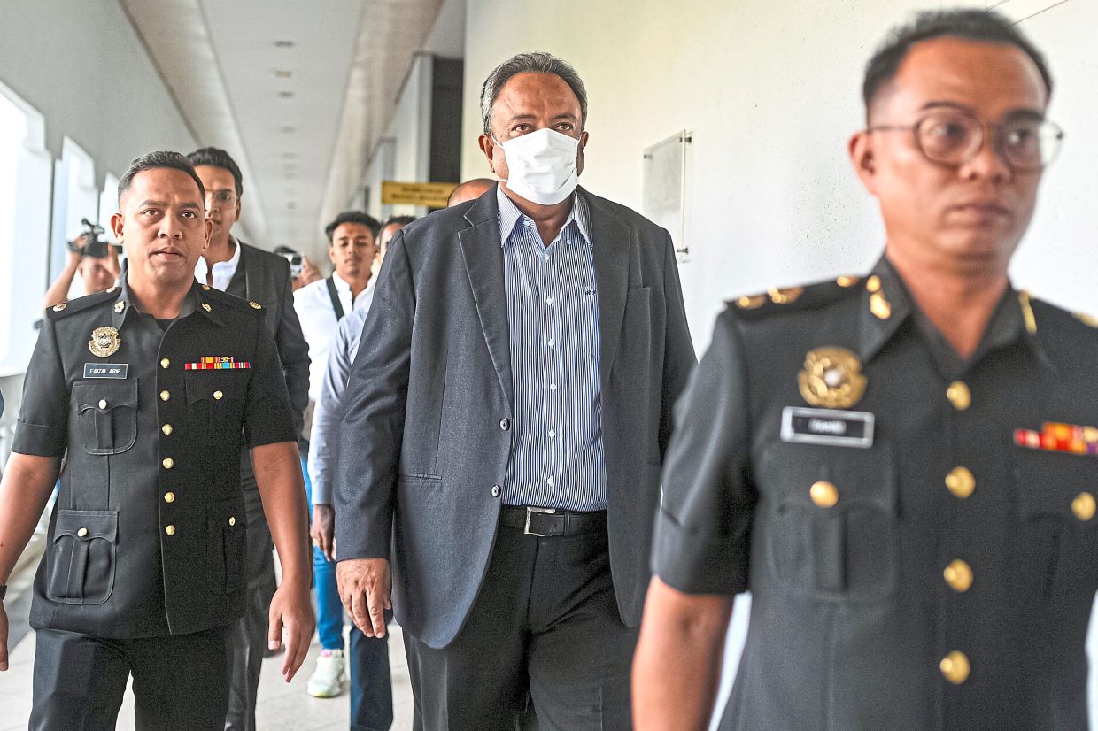 Court day: Ranjeet (right) pleaded not guilty at the Sessions Court to a charge of giving a bribe of RM8mil to a former bank president 14 years ago. — Bernama